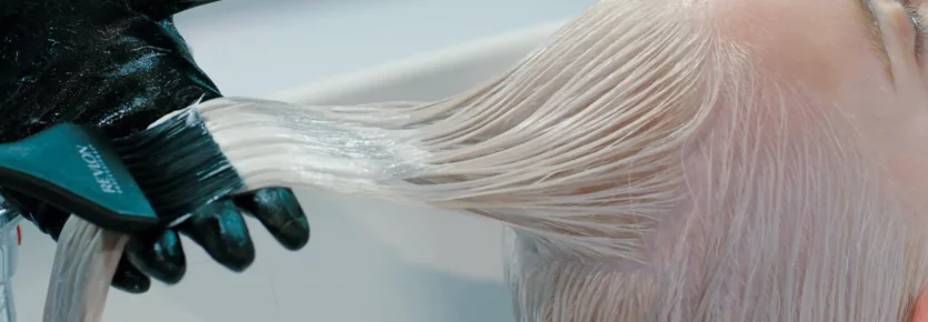 A woman with wet platinum hair