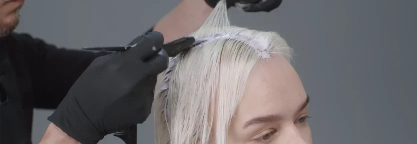 A woman with her hair being colored